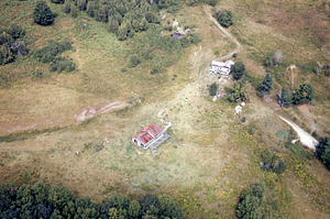 Aerial oblique view north of Andrew Bernardy's, Farm house and dairy barn on 2 Sept 1971.