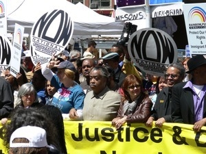 Al Sharpton (left) and Susan Sarandon at the head of the antiwar marchers in the streets of New York, with signs and banners opposing the war in Iraq