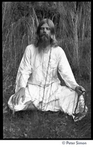 Bhagavan Das: full length portrait seated in a lotus position, facing the camera