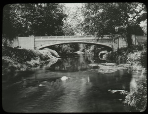 Cement arch bridge over river
