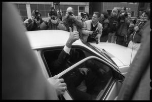 Gary Hart giving a thumb's up from a limousine after a rally to renew his bid for the Democratic nomination for the presidency