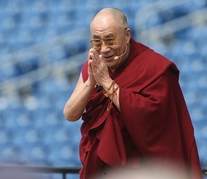 Dalai Lama bowing to the crowd at Gillette Stadium at a public talk ,'The Path to Peace and Happiness,' hosted by the Tibetan Association of Boston