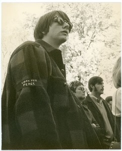 Young man in the crowd at an anti-Vietnam War protest at the First Congregational Church, wearing a Work for Peace armband