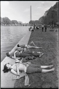 May Day concert and demonstrations: sunbathers by the Reflecting Pond, Washington Monument in the background