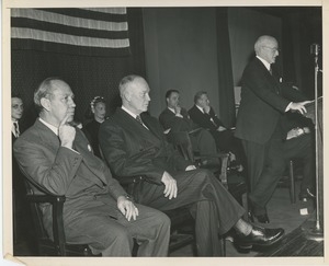 Staff and attendees on stage at Institute Day