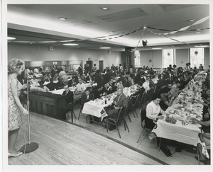 Performer and audience at Thanksgiving celebration