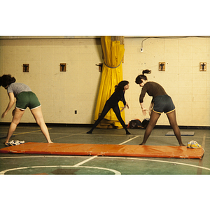 Women stretching in a gym