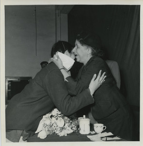 Shirley Graham Du Bois hugging an unidentified woman
