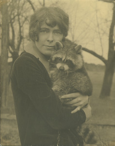 Almeda Walker holding raccoon