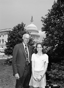 Congressman John W. Olver with a visitor, posed in front of the United States Capitol building