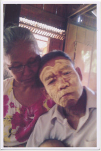 A photograph of Htu Htu Paw's parents wearing thanaka during the Water Festival in Burma, 2011