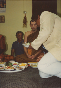 Money Tree: A man placing food in front of Venerable John Massey, 1987