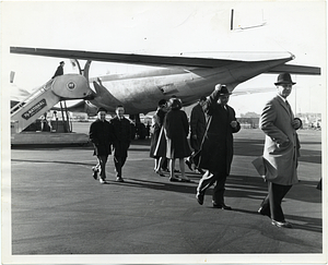 Unidentified people on a tarmac