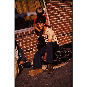 Boy posing for photo on bicycle racks