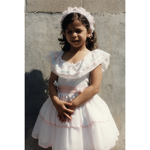 A young girl in a white dress