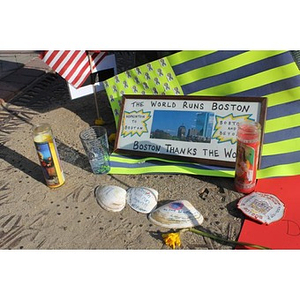 Seashells and other items left at Copley Square memorial