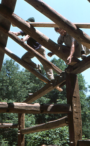 Lauren Stevens(left) and Hank Art (right) setting rafter braces at the Moon Barn Raising at entrance to Hopkins Forest on 2 August 1975.