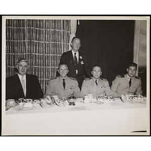 Tip O'Neill, on the far left, seated with three men while another stands behind them at the Kiwanis Club's Bunker Hill Postage Stamp Luncheon