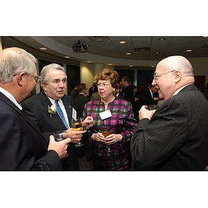 Neal Finnegan stands with three others at The National Council Dinner