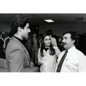 Two men and a women speaking at the Law School Open House, 1985