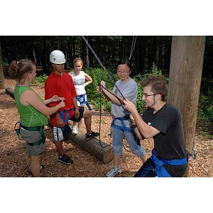 Jordan Munson pulls on a rope during the Torch Scholars Project Adventure Ropes Course