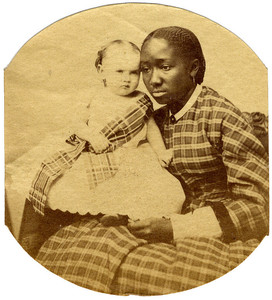 Portrait of an unidentified woman holding an infant on her lap, ca. 1865