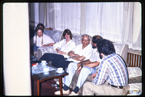 Dinner for Zhou Peiyuan: Zhou, seated on couch, talking with Science for the People members