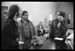 Judy Collins chatting with unidentified men