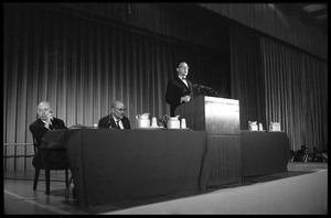 Arthur M. Schlesinger, Jr., speaking at the National Teach-in on the Vietnam War, with other panelists Hans J. Morgenthau (left) and Isaac Deutscher