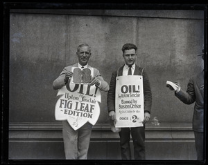 Upton Sinclair and supporter (possibly his son David)M protesting at censorship hearings for his novel Oil!, wearing sandwich boards reading 'Oil!... fig leaf edition' and '...banned by Boston censor'