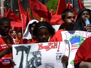 Marchers with Youth United for Change banner, marching in the streets to oppose the war in Iraq