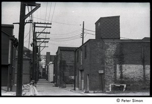 Karen Helberg, standing by row of brick buildings in York, Pa.