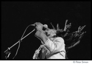 Bob Marley in concert, gesturing to the audience