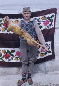 Posing with a roast lamb