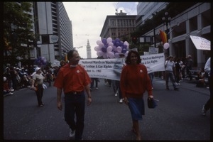 Newly-elected Congressional Representative Nancy Pelosi (red sweater) marching in the San Francisco Pride Parade in front of a banner for the National March on Washington for Lesbian and Gay Rights