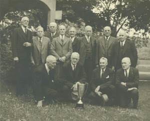 Class of 1892 posing outside at their 50th reunion. Back row: Faneuf, Rogers, Knight, Williams, Lyman, Willard, Field, and Toylor. Front row: Emerson, Boynton, Holland