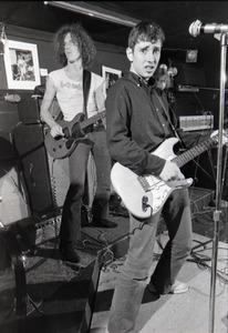 Jonathan Richman and the Modern Lovers at Sandy's: Richman facing camera, Ernie Brooks (bass) and John Felice (guitar) in background