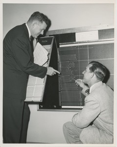 Willis C. Gorthy and an unidentifed man chart board at an ICD field workshop