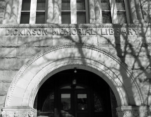 Dickinson Memorial Library: front entrance with shadow of a tree