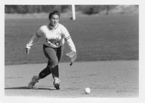 Suffolk University women's softball player Jennifer Lombardi fielding a ground ball, circa 1991