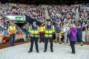 Two Garda (police) at the entrance to a tunnel, at the 2012 50th Eucharistic Congress, Final Day Ceremony, 17th June, at Croke Park GAA Stadium, Dublin