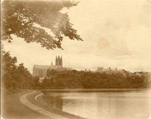 Devlin tower, Gasson Hall, Saint Mary's Hall, and Bapst Library Ford Tower from path around reservoir, by Clifton Church