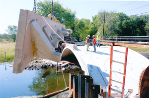 Pelham Island Road arch bridge spandrell wall being loaded onto new arches