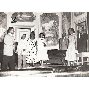 Unknown individuals performing in a community play at the Norfolk House