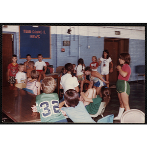 Eighteen boys and girls gather in the Charlestown Boys and Girls Clubhouse