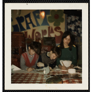 Two boys and a girl working on projects for their art class at the South Boston Boys' Club