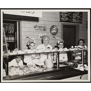 Members of the Tom Pappas Chefs' Club pose with serving staff in the Hanscom Field Air Force Base restaurant