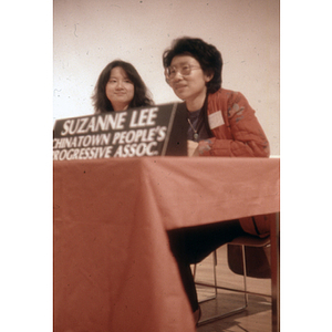 Suzanne Lee and another woman sit at table as representatives of the Chinese Progressive Association