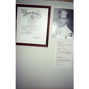 Military honors are seen on the wall of a museum or visitor's center