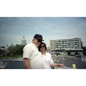 Man and woman pose together while on a trip to Toronto